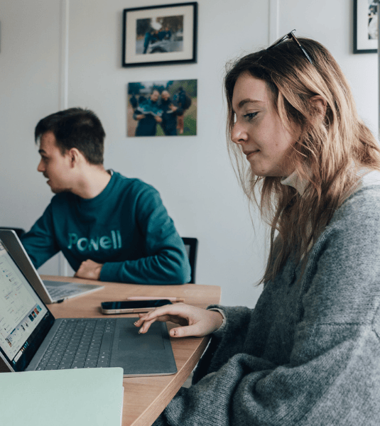 Powell employees in office working together