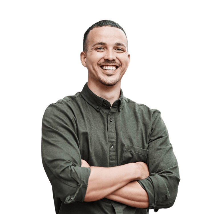 man smiles with folded arms